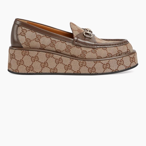 Gucci's signature GG canvas loafers with a platform sole & leather trim. - Picture 1 of 8